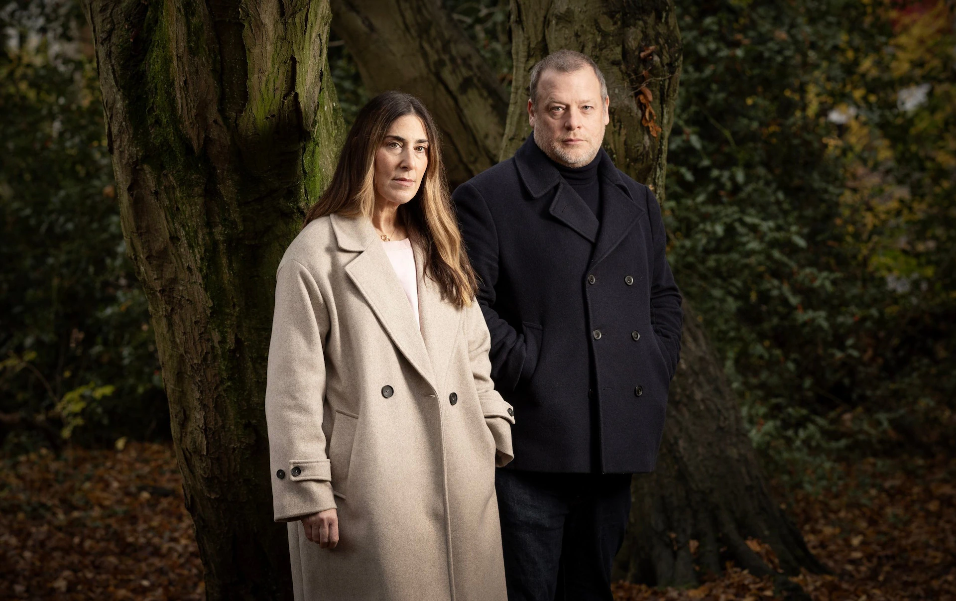 press image of two people in the woods